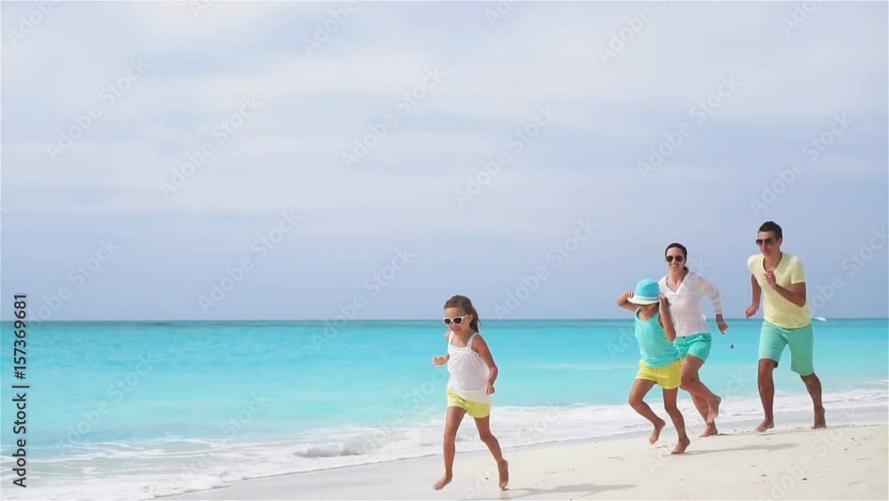 Young family on vacation have a lot of fun on the beach. Slow motion. Young family on vacation have a lot of fun on the beach. Slow motion.