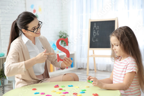 Young woman teacher and lit...