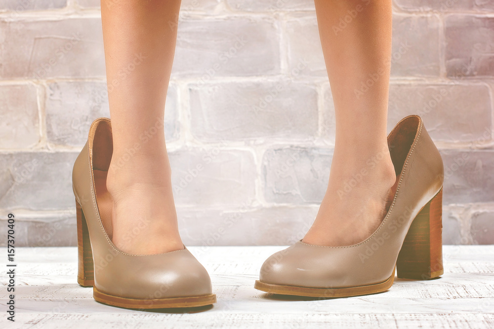 Little girl wearing mom's shoes Stock Photo Adobe Stock