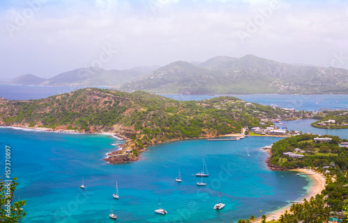 Antigua, Caribbean islands, English harbour view with Freeman’s bay and yachts anchored by the beach 