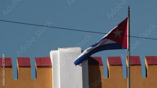 Flag of Cuba flying over Moncada Barracks in Santiago of Cuba photo