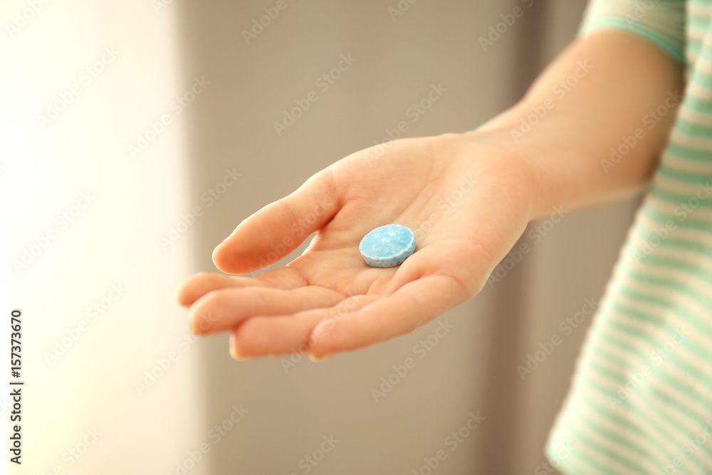 Female hand with rat poison on blurred background Female hand with rat poison on blurred background