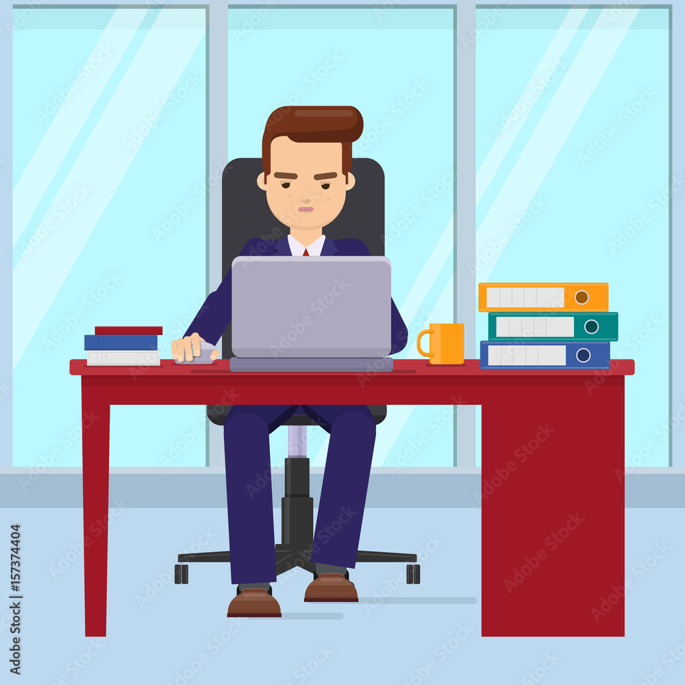Businessman working in office with a laptop Businessman working in office with a laptop