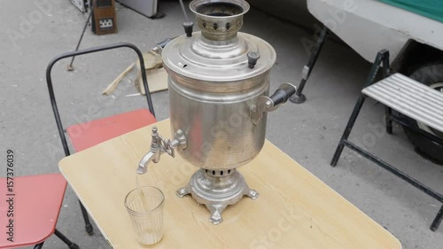 Old Samovar standing on the table. UltraHD stock footage. photo