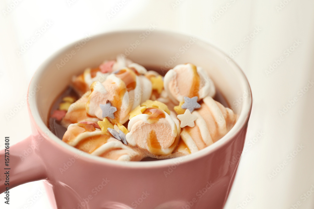 Cup of tasty cocoa with marshmallow on light background, closeup Cup of tasty cocoa with marshmallow on light background, closeup