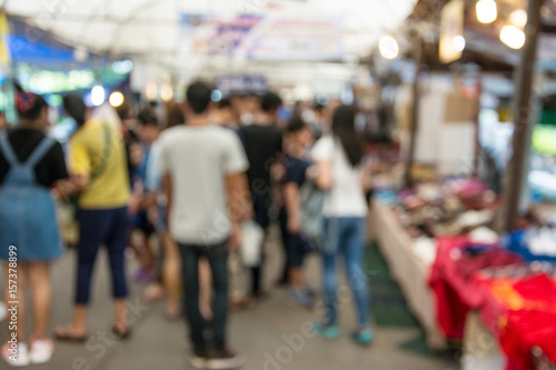 Blurred image of people walking at market