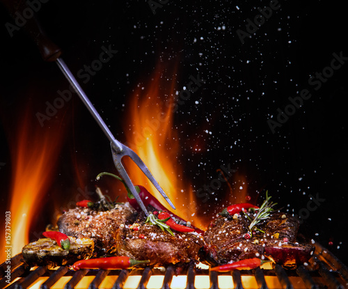 Beef steaks on the grill wi...