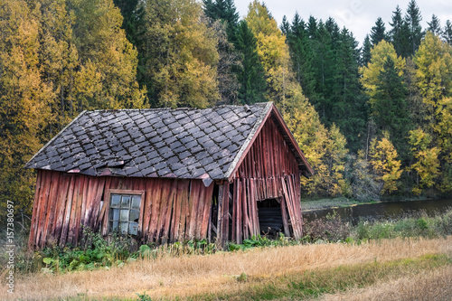 Abandoned shed with autumn colors at day time