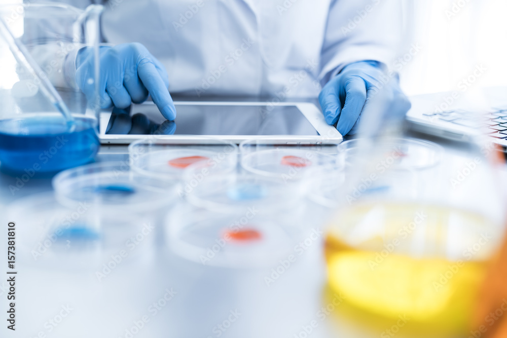 The researcher is tapping the tablet The researcher is tapping the tablet