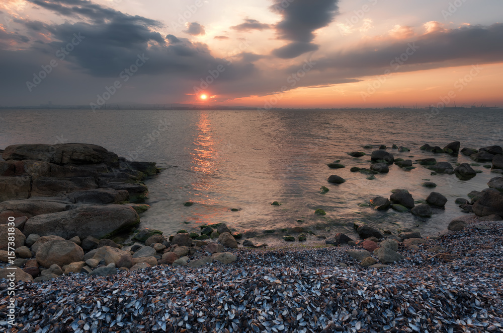 Magnificent cloudy sunset over the sea. Spring sunset, landscape, seascape. Magnificent cloudy sunset over the sea. Spring sunset, landscape, seascape.