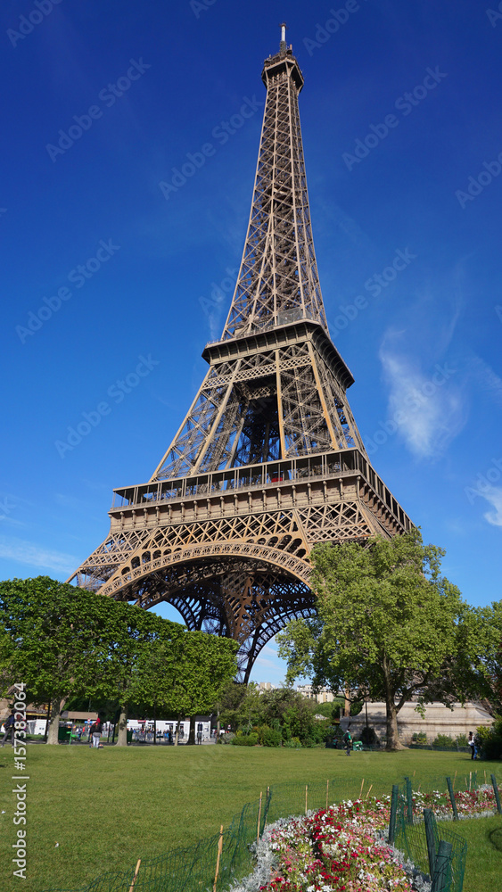Fototapeta premium Photo of Eiffel Tower on a spring cloudy morning, Paris, France