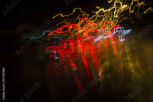 chaos traffic lights in motion blur abstrst background photo