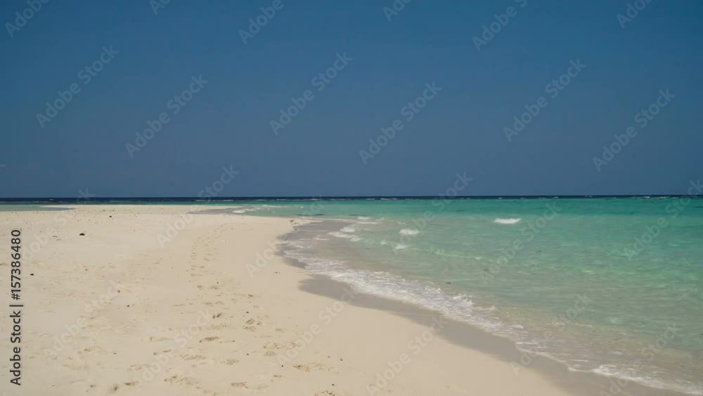 Beach, sea, sand,wave. Tropical beach, blue sky, clouds. Seascape ocean and beautiful beach paradise.Philippines 4K video Travel concept Beach, sea, sand,wave. Tropical beach, blue sky, clouds. Seascape ocean and beautiful beach paradise.Philippines 4K video Travel concept