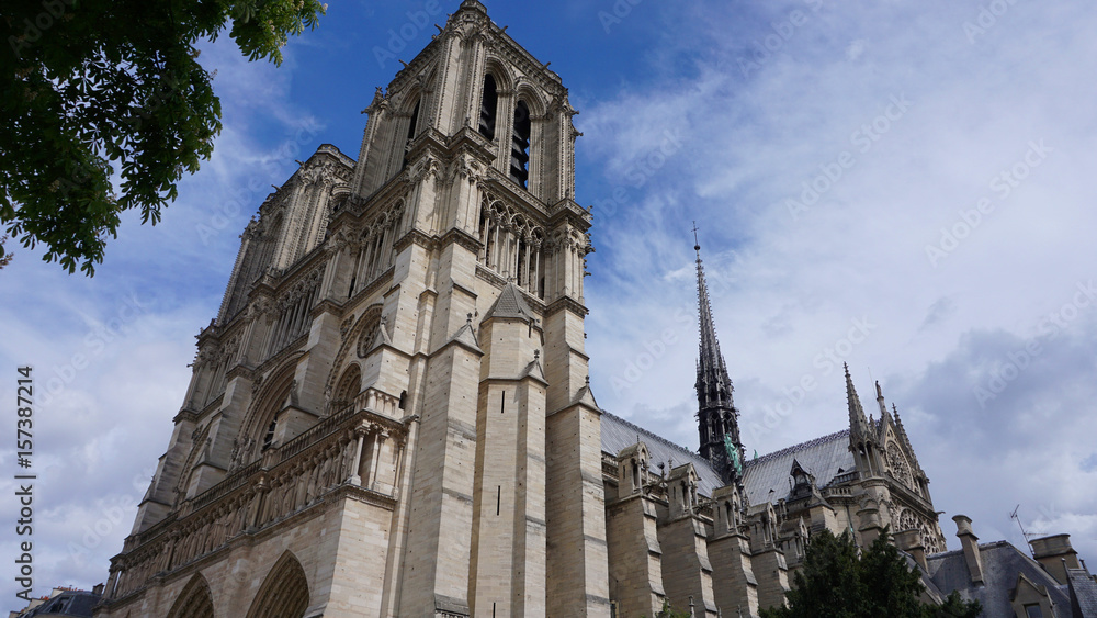 Photo of famous Notre Dame cathedral on a cloudy spring morning, Paris, France Photo of famous Notre Dame cathedral on a cloudy spring morning, Paris, France