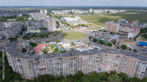 Aerial shot of Kherson with extra long apartment block in summer photo