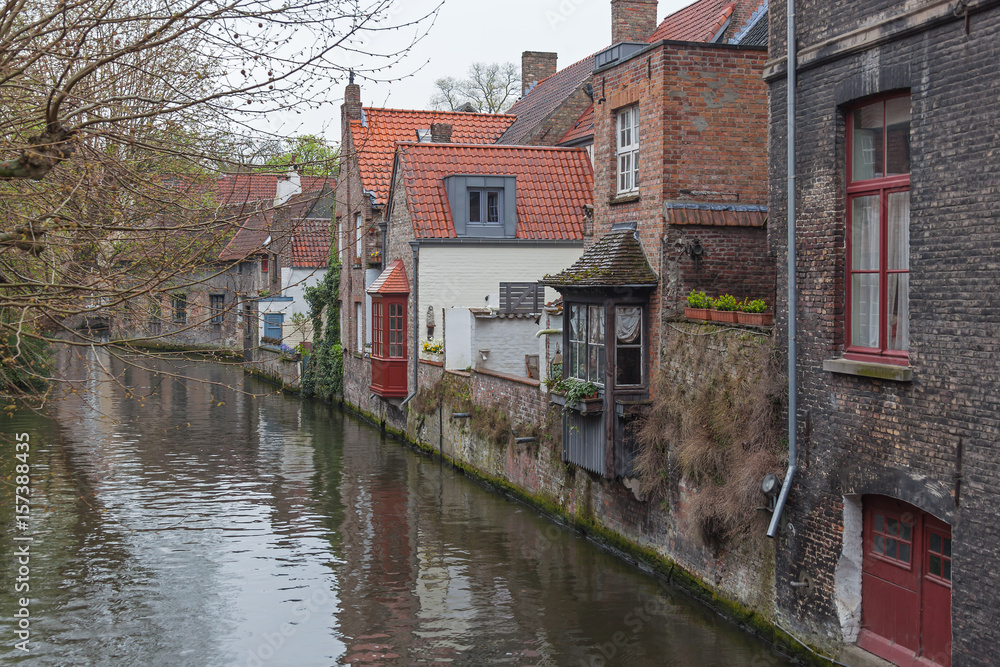 Beautiful view on canal with old picturesque houses in historic part of Bruges (Brugge), Belgium