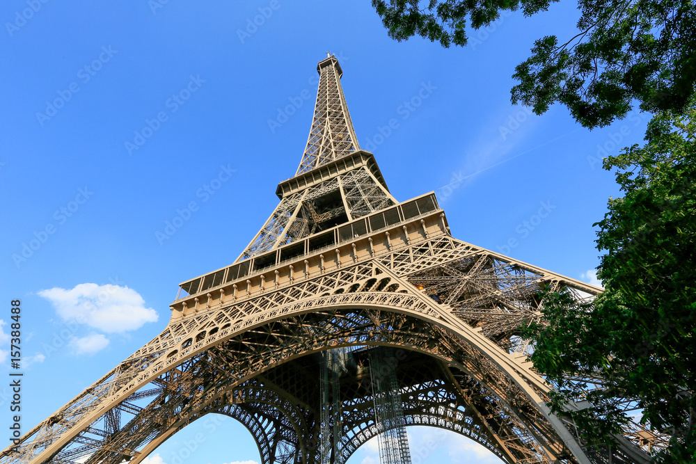 Eiffel Tower with blue sky, Paris France - obrazy, fototapety, plakaty 