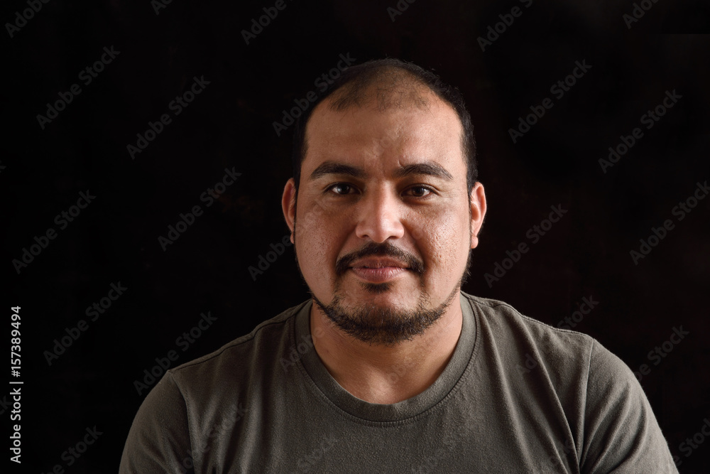 Portrait of a latin man on black background Portrait of a latin man on black background