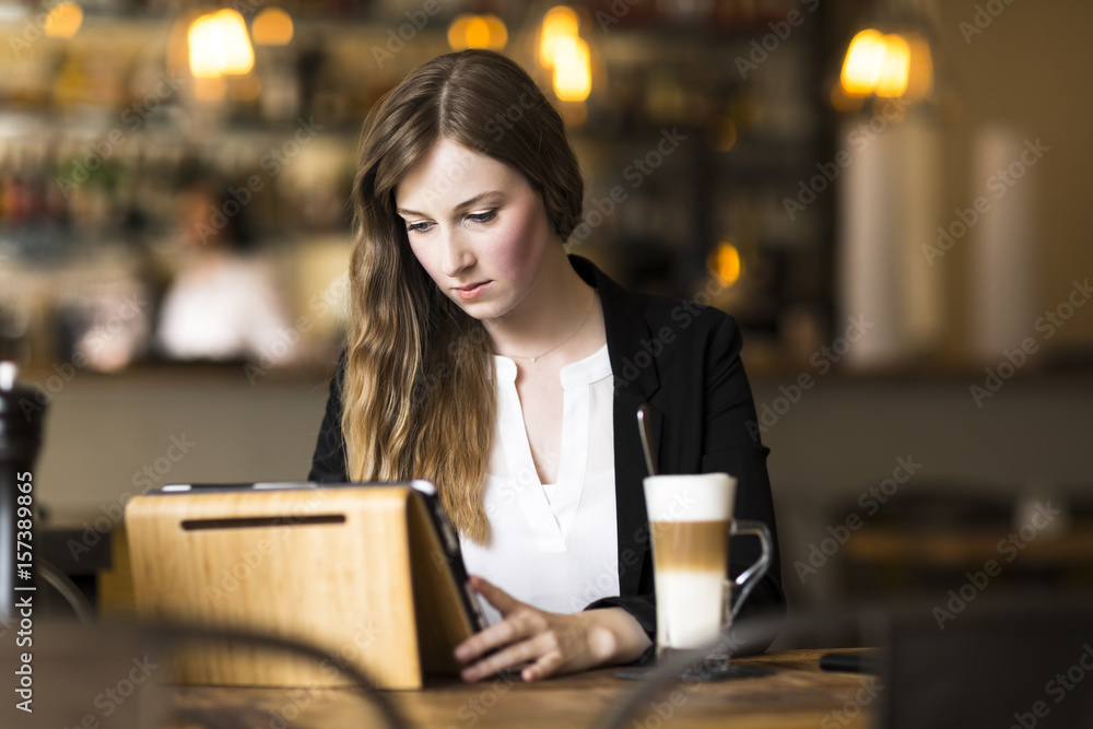 Fototapeta premium young business woman working at cafe at break
