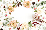 Round frame wreath with dried flowers: beige peony, protea, eucalyptus branches, roses on white background. Flat lay, top view. Floral background