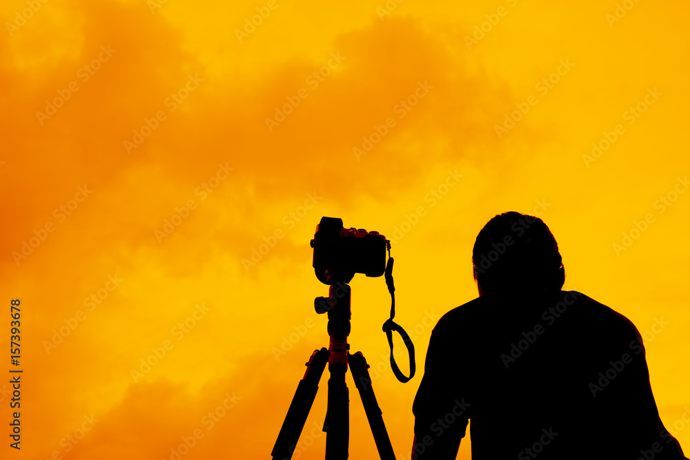 Camera woman is looking at Sunset