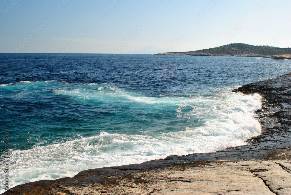 Waves On The Blue Sea stone beach