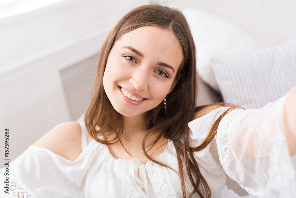 Cute smiling girl making selfie Cute smiling girl making selfie