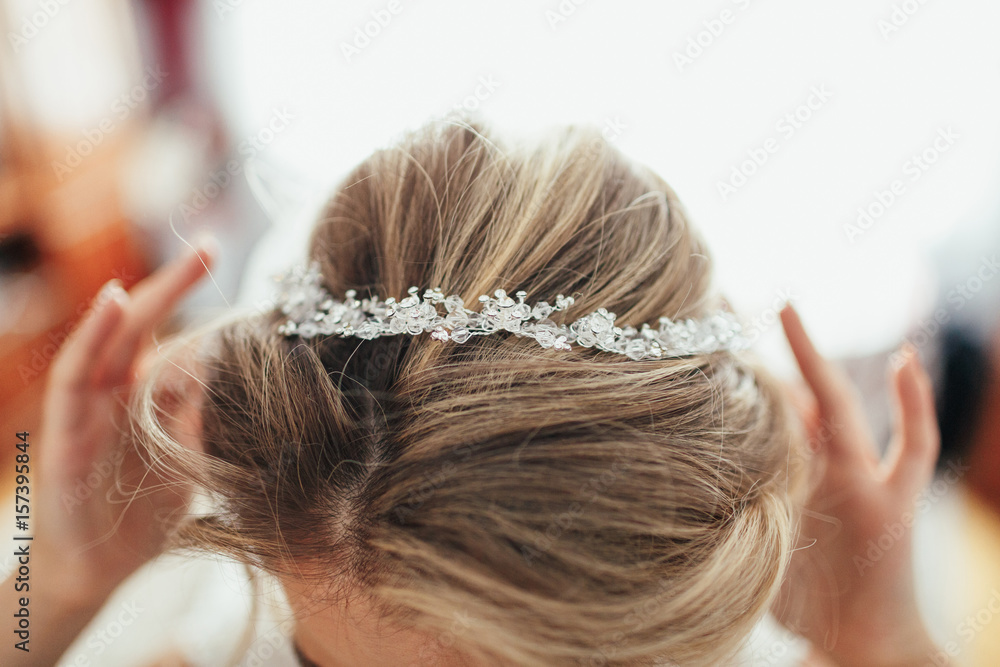 Fototapeta premium Look from above at crystal wreath on bride's head