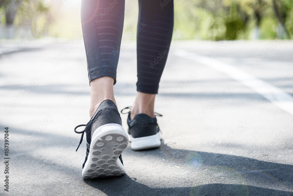 Young beautiful sportive girl preparing to run