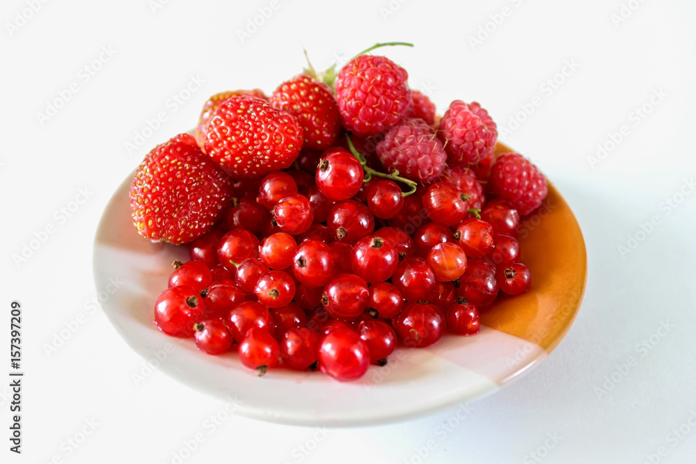 Ripe red berries on a plate Ripe red berries on a plate