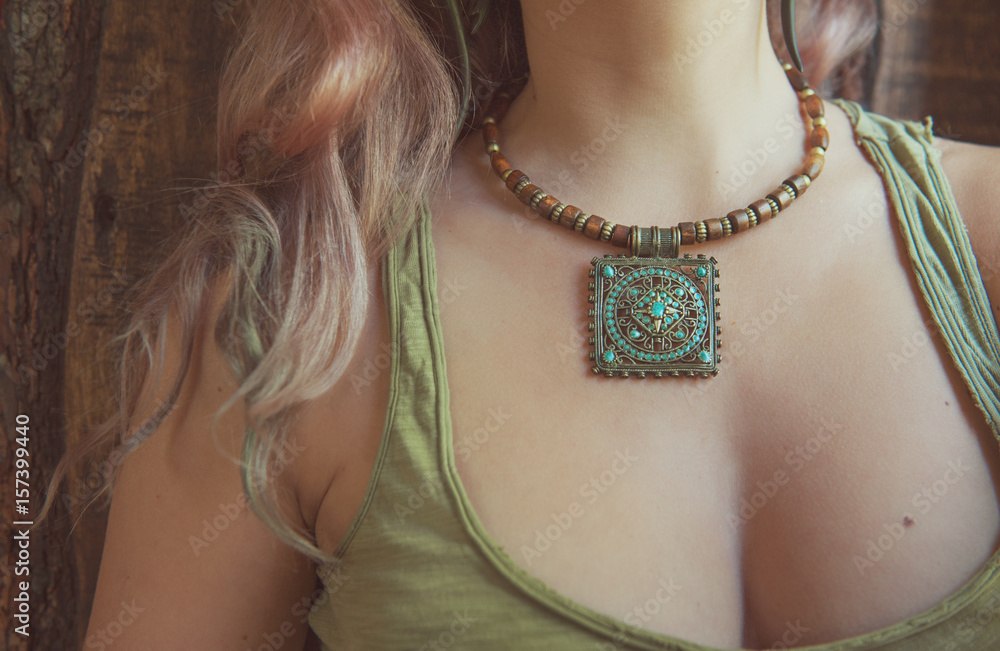 Beautiful woman with necklace boho style