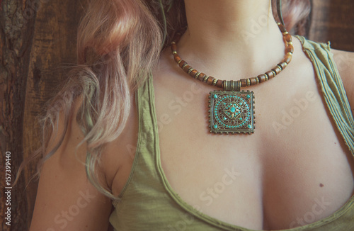 Beautiful woman with necklace boho style