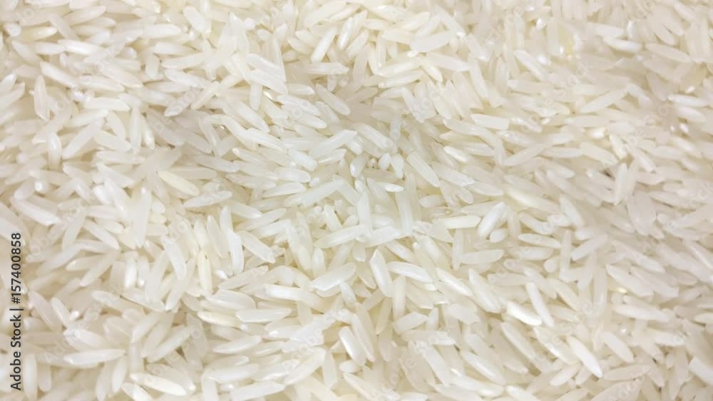 Great background of White rice seeds are rotating close up. Footage will work great for any videos dealing with cooking, health nutrition, Japanese food, restaurants and much more. Great background of White rice seeds are rotating close up. Footage will work great for any videos dealing with cooking, health nutrition, Japanese food, restaurants and much more.