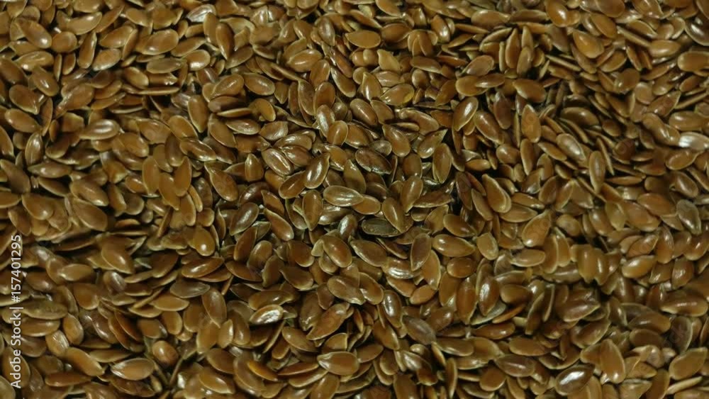 Great background of Organic flax seeds rotating close up. Footage will work great for any videos dealing with cooking, health nutrition and much more. Great background of Organic flax seeds rotating close up. Footage will work great for any videos dealing with cooking, health nutrition and much more.