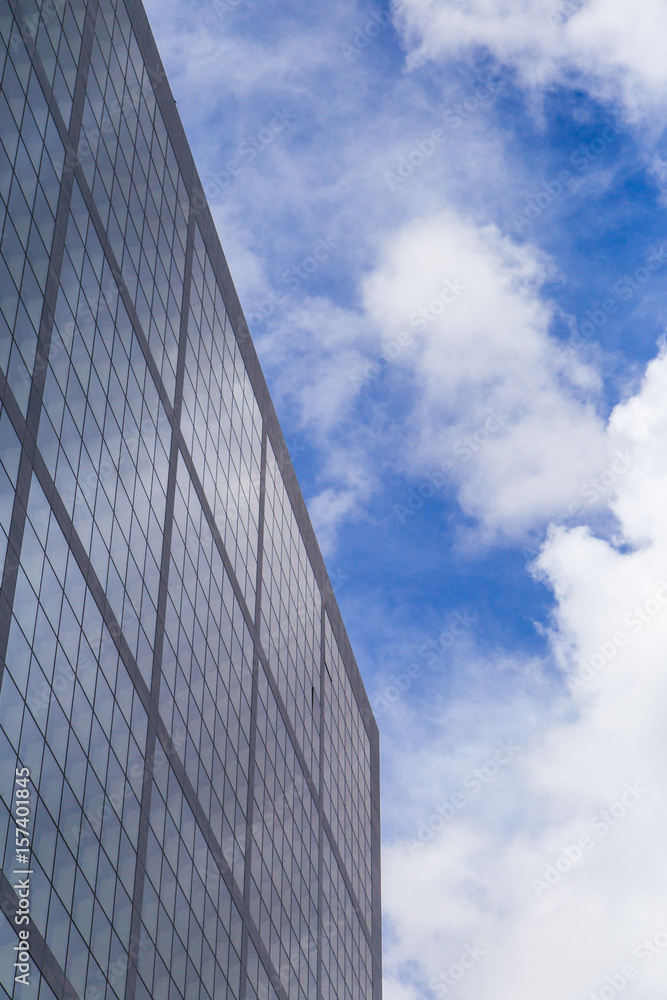 Modern blue glass wall of skyscraper. Business building, office center. Abstract architecture, fragment of modern urban geometry. Background lines Modern blue glass wall of skyscraper. Business building, office center. Abstract architecture, fragment of modern urban geometry. Background lines