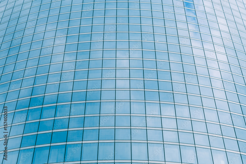 Modern blue glass wall of skyscraper. Business building, office center. Abstract architecture, fragment of modern urban geometry. Background lines Modern blue glass wall of skyscraper. Business building, office center. Abstract architecture, fragment of modern urban geometry. Background lines