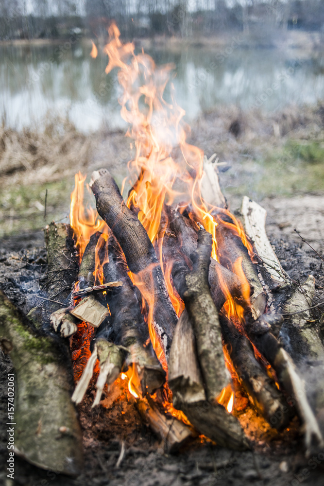 Campfire by the lake, summer time. Campfire by the lake, summer time.