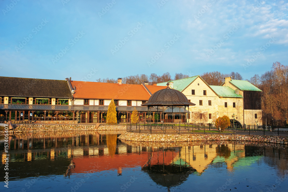 Buildings at pond in Belmontas Pavilniai regional park near Vilnius
