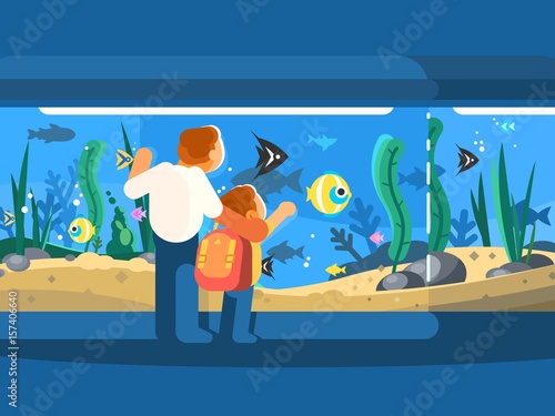 Dad with son in oceanarium
