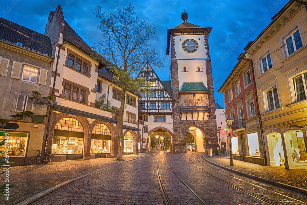 Schwabentor - historical city gate at dusk in Freiburg im Breisgau, Baden-Wurttemberg, Germany