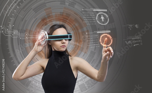 Canvas Print Woman touching the virtual future interface