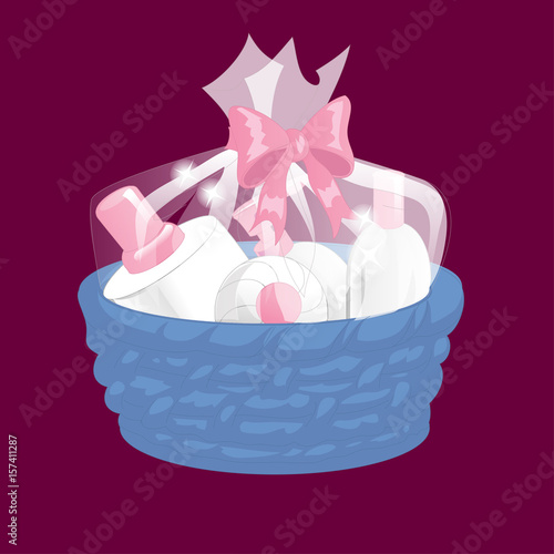Basket with cosmetics gifts, transparent top and pink bow-knot.
