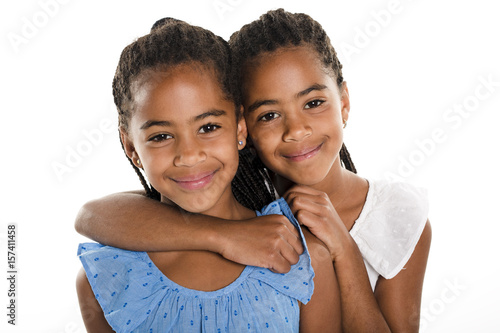 Two Adorable african twin girl on studio white background