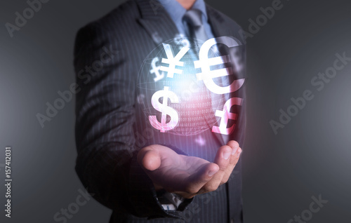 Investor holding world of currency