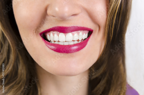 Woman with perfect teeth  closeup  focus on mouth  shallow depth of field 