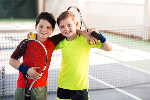 Happy children entertaining on tennis court © Yakobchuk Olena