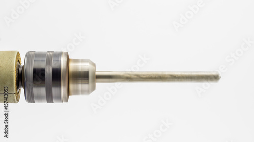 Rotating drill bit isolated on white background