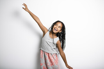 Adorable african little girl on studio gray background