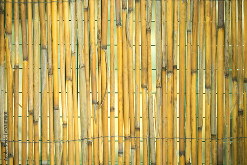 Wall of home made of bamboo