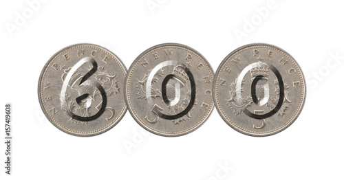 Number 600 with five pence coins